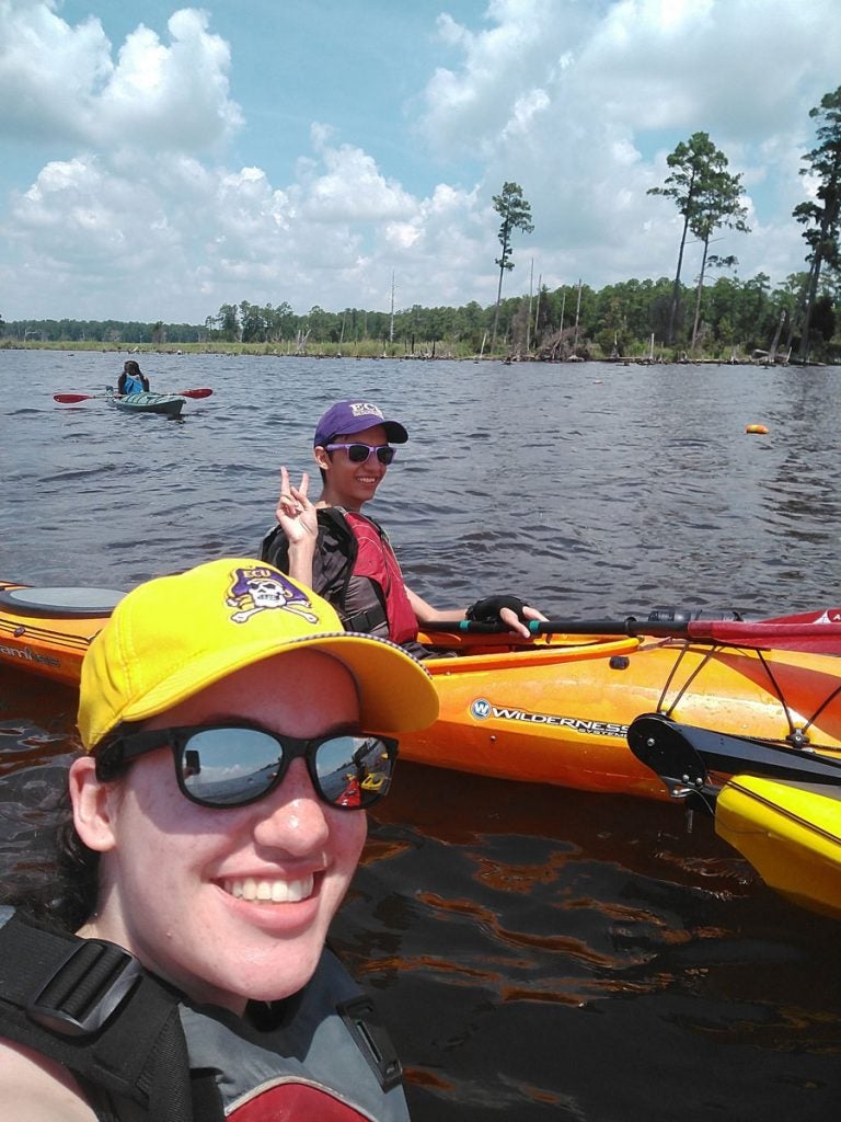 students in kayaks on the water