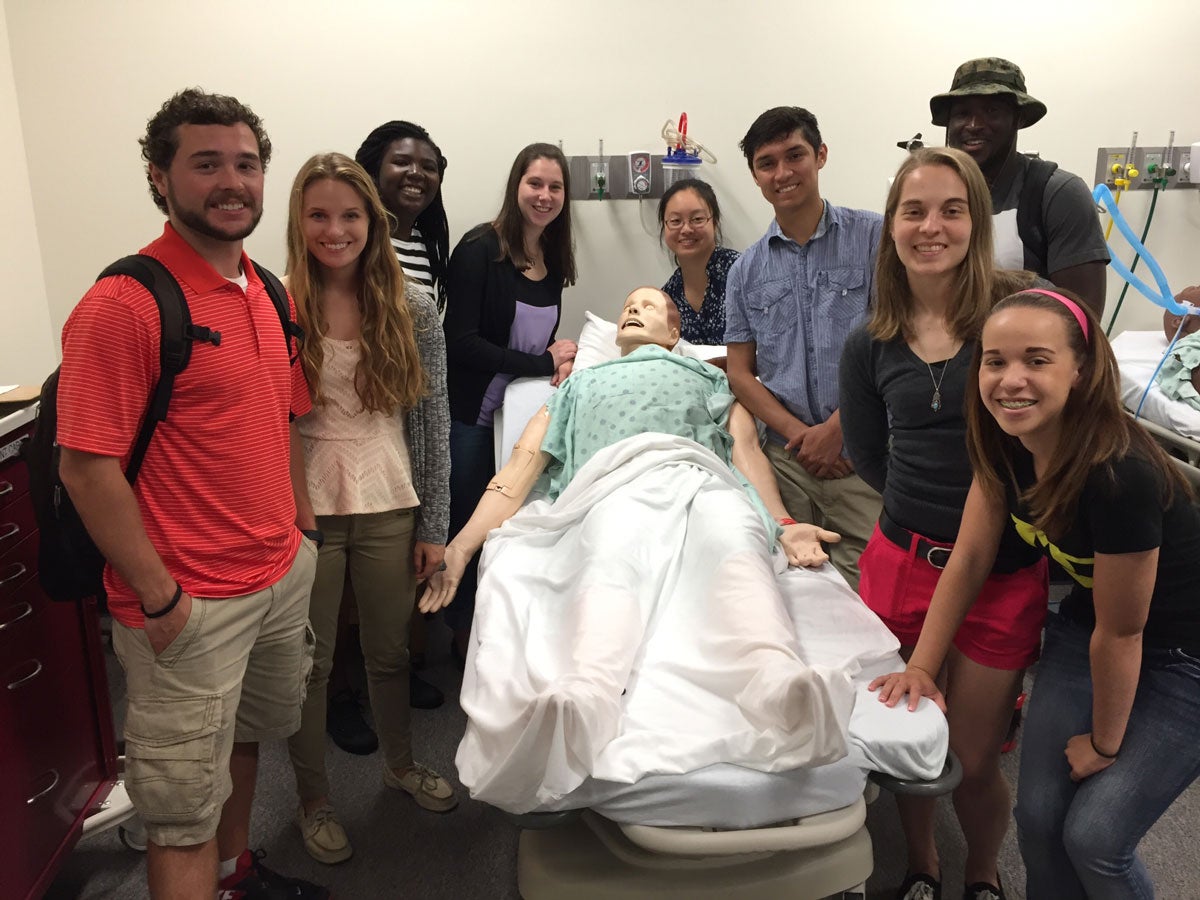 students in the simulation lab with a dummy