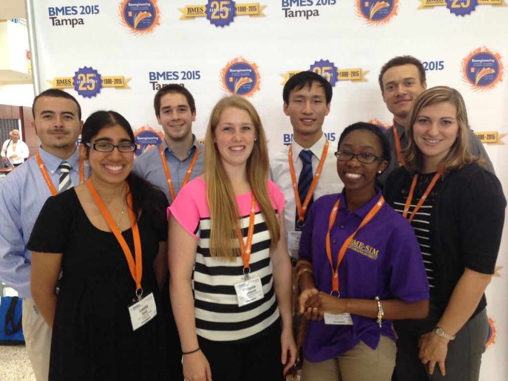 Group of students in front of a BMES 2015 Tampa background