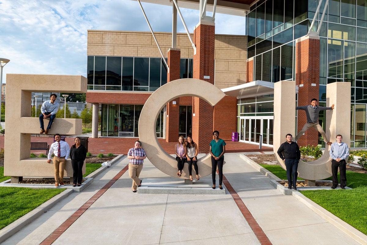 Group of students with large ECU letters outside the Main Campus Student Center