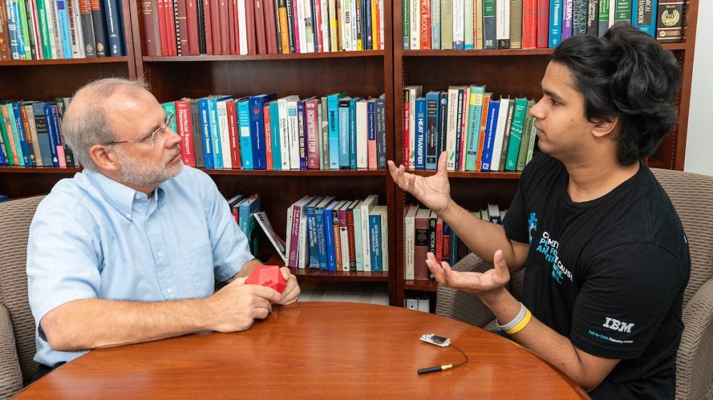 CET Dean Harry Ploehn, left, with Magus Pereira in the Dean's Office. 
