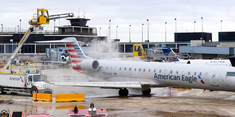 An American Eagle aircraft is deiced at O’Hare Airport in Chicago. Dr. Yang Liu, an engineering professor at East Carolina University, is conducting research to help improve anti-icing and deicing techniques to prevent aircraft crashes. (Photo from Bigstock)