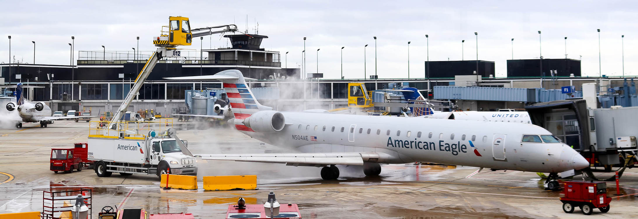 An American Eagle aircraft is deiced at O’Hare Airport in Chicago. Dr. Yang Liu, an engineering professor at East Carolina University, is conducting research to help improve anti-icing and deicing techniques to prevent aircraft crashes. (Photo from Bigstock)