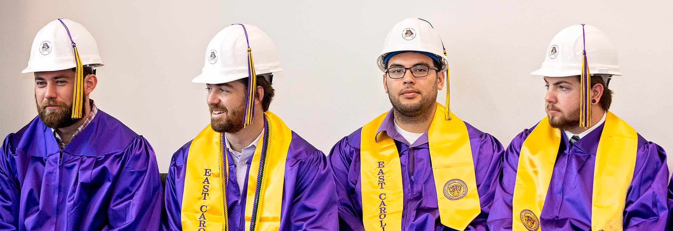 Construction Management graduates are shown in their traditional hard hats during commencement in December. Spring 2020 graduates will receive their hard hats by mail. (Photo by Cliff Hollis)