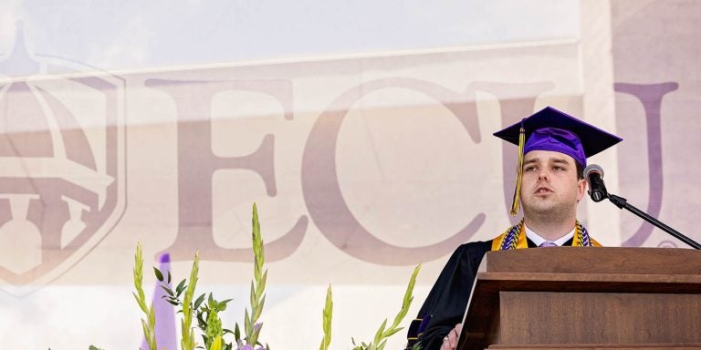 Tucker Robbins, East Carolina University Student Government Association president from Wilson, speaks during commencement on Friday at Dowdy-Ficklen Stadium. Robbins graduated with a degree in industrial distribution and logistics. (ECU photo by Cliff Hollis)