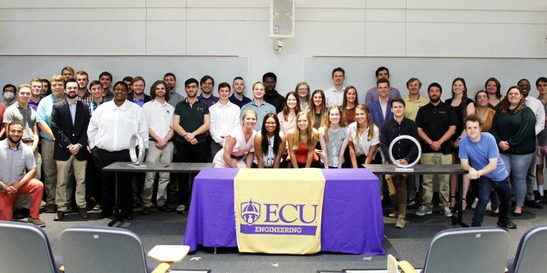 ECU students pose for a picture after being inducted into the Order of the Engineer during a ceremony on Tuesday in the Science and Technology Building. (Photos by Ken Buday)
