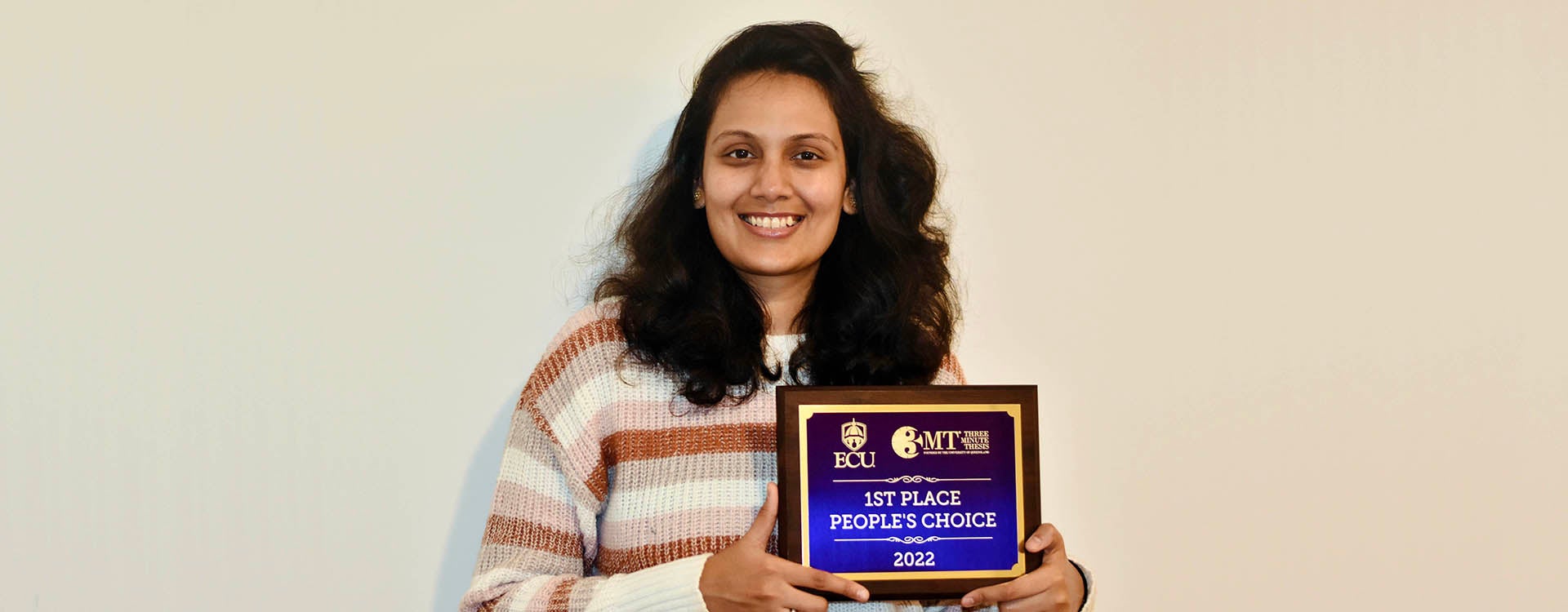 Ashwinee Mehta, a graduate student in the Department of Computer Science, displays her People’s Choice Award from the Graduate School’s annual Three-Minute Thesis (3MT) Competition. (Contributed photo)