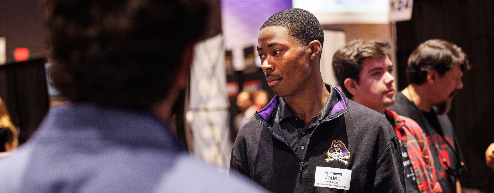 Construction management student Jaden Armstrong meets with employers during the Science, Engineering and Technology Fair Wednesday at the Greenville Convention Center. (Photo by Cliff Hollis)