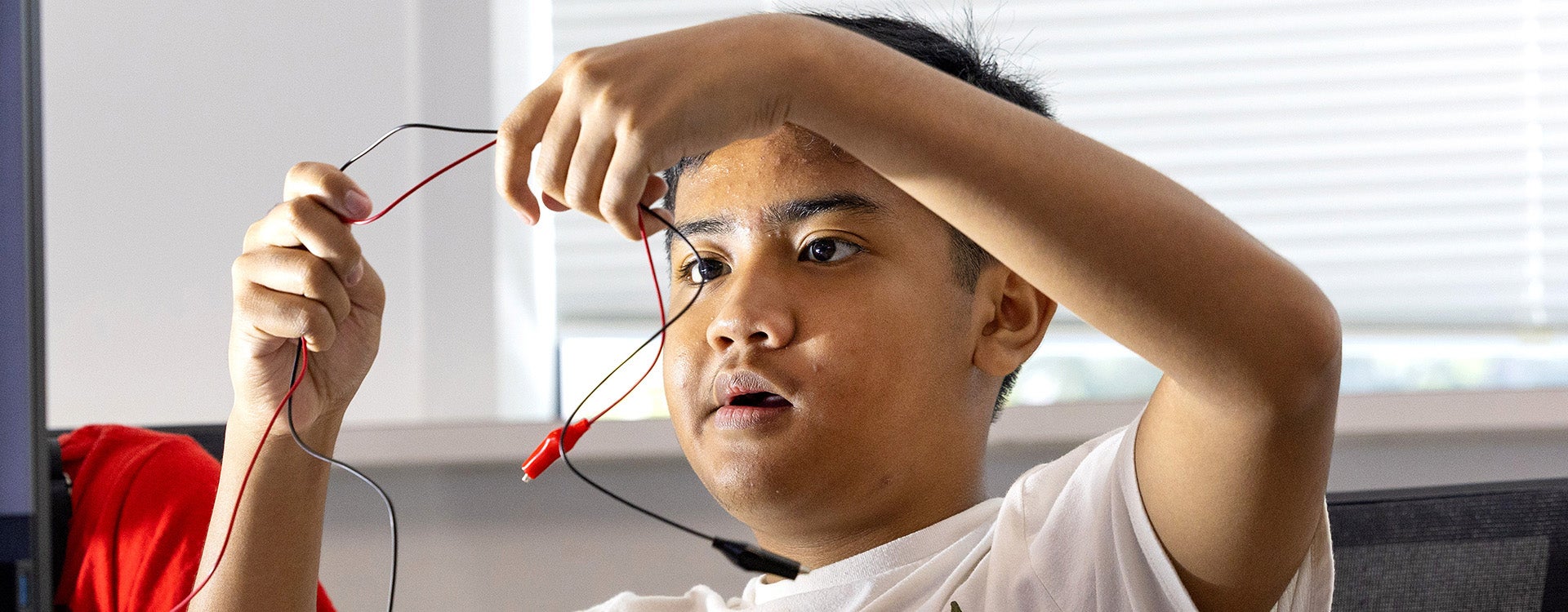 Dustin Mondejar, 13, sorts wires as part of a solar energy experiment during the Department of Technology Systems’ Renewable Energy and Green Manufacturing Academy summer camp at ECU. (Photos by Rhett Butler)